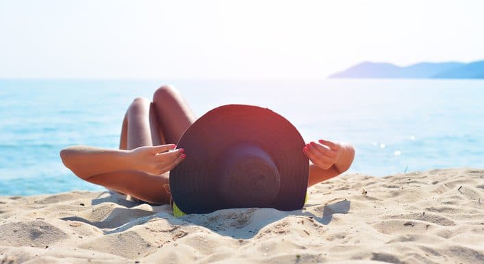 Pretty woman sunbathing on the beach