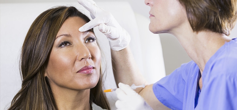 middle aged woman receiving botox treatments