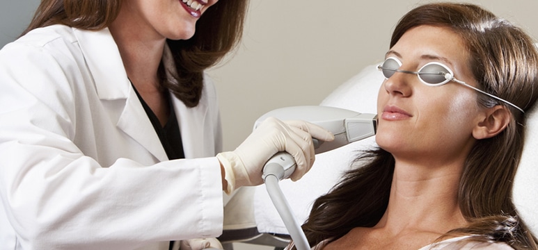 female patient receiving laser treatment on her face